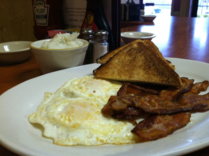 Eggs, bacon, toast and grits.
